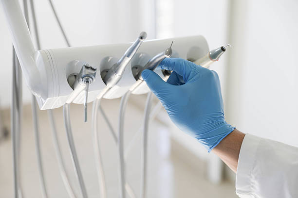 Professional Tooth Extraction technician working in Coles County County, IL